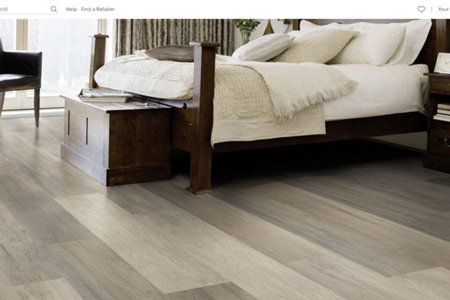 Hybrid and luxury vinyl plank flooring installed in a bedroom